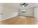 Well-lit bedroom with hardwood floors, a window, and a neutral color palette at 2272 Adam Ct, Palm Harbor, FL 34683