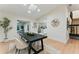 Well-lit dining area with a dark wood table, cozy chairs, and modern decor, perfect for Gathering meals at 2272 Adam Ct, Palm Harbor, FL 34683