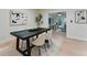 Inviting dining room featuring a dark table, plush chairs, and stylish artwork, creating a cozy atmosphere at 2272 Adam Ct, Palm Harbor, FL 34683