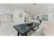 Elegant dining room features a modern table, plush chairs, and stylish decor, ideal for hosting gatherings at 2272 Adam Ct, Palm Harbor, FL 34683