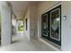 Inviting front entrance with decorative double doors, covered porch, and neutral tones at 2272 Adam Ct, Palm Harbor, FL 34683