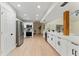 Modern kitchen featuring white cabinets, stainless steel appliances, and a bright, open layout, perfect for cooking at 2272 Adam Ct, Palm Harbor, FL 34683