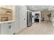 Bright kitchen featuring white cabinets, stainless steel appliances, and ample counter space, perfect for cooking and entertaining at 2272 Adam Ct, Palm Harbor, FL 34683