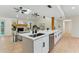 Modern kitchen with stainless steel appliances, a sleek island, and an open view into the living area, ideal for entertaining at 2272 Adam Ct, Palm Harbor, FL 34683