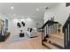 Bright living room boasts hardwood floors, contemporary decor, and ample natural light, creating a welcoming atmosphere at 2272 Adam Ct, Palm Harbor, FL 34683