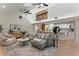 A large living room with high ceilings, a brick fireplace and an open kitchen concept at 2272 Adam Ct, Palm Harbor, FL 34683