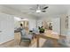 An open floor plan featuring an office, kitchen, and living room with hardwood floors at 2272 Adam Ct, Palm Harbor, FL 34683