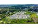An aerial shot of townhomes located near a pond, offering a serene living environment and lush scenery at 2435 Foggy Creek Cir, Clearwater, FL 33764