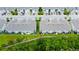View of screened porches and greenery offer privacy to the occupants in these aerial shot of townhomes at 2435 Foggy Creek Cir, Clearwater, FL 33764
