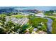 Aerial shot of townhomes, next to ponds and rich greenery, offering peaceful, private living spaces at 2435 Foggy Creek Cir, Clearwater, FL 33764