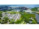 An aerial view of a community near the water shows well-maintained landscaping and community ponds at 2435 Foggy Creek Cir, Clearwater, FL 33764