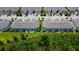 Aerial view shows new townhomes with private backyards and well-maintained landscaping at 2435 Foggy Creek Cir, Clearwater, FL 33764