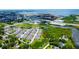 Townhomes shown from above, close to ponds and lush green spaces, offer privacy at 2435 Foggy Creek Cir, Clearwater, FL 33764