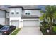 Charming townhome with a two car garage, paved driveway, and lovely landscaping at 2435 Foggy Creek Cir, Clearwater, FL 33764