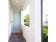 Inviting front entrance with a light blue door and a decorative cat planter at 2435 Foggy Creek Cir, Clearwater, FL 33764
