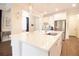 Spacious kitchen island with a sink, quartz countertops, and modern fixtures at 2435 Foggy Creek Cir, Clearwater, FL 33764