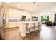 Modern eat-in kitchen with island seating, sleek appliances, and hardwood floors at 2435 Foggy Creek Cir, Clearwater, FL 33764