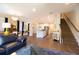 Spacious open-concept living area with modern furnishings, hardwood floors, and plenty of natural light at 2435 Foggy Creek Cir, Clearwater, FL 33764