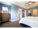 Spacious bedroom featuring hardwood floors, ample natural light, and ensuite bathroom access at 2435 Foggy Creek Cir, Clearwater, FL 33764
