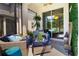 Cozy outdoor patio with comfortable seating, decorative plants, and access to the interior at 2435 Foggy Creek Cir, Clearwater, FL 33764
