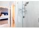 Modern bathroom featuring tiled shower with glass door and built-in shelving at 2435 Foggy Creek Cir, Clearwater, FL 33764
