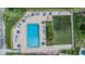 An aerial view highlights the community pool and putting green, perfect for recreation and relaxation at 2465 Northside Dr # 605, Clearwater, FL 33761