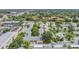 An aerial view showcases a vibrant neighborhood with lush trees and well-maintained residences at 2465 Northside Dr # 605, Clearwater, FL 33761