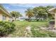 Well-maintained backyard featuring mature palm trees and landscaping of multiple units in the community at 2465 Northside Dr # 605, Clearwater, FL 33761