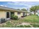 Lush backyard featuring well maintained landscaping and exteriors of multiple units in a well maintained community at 2465 Northside Dr # 605, Clearwater, FL 33761