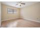 Comfortable bedroom featuring laminate floors, ceiling fan, and ample natural light at 2465 Northside Dr # 605, Clearwater, FL 33761