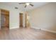 Bedroom featuring laminate flooring and ensuite bathroom at 2465 Northside Dr # 605, Clearwater, FL 33761