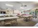 The community room offers residents a large open space, tables, chairs, and a pool table at 2465 Northside Dr # 605, Clearwater, FL 33761