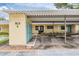 Building 6 featuring covered parking, storage, and manicured landscaping creating curb appeal at 2465 Northside Dr # 605, Clearwater, FL 33761
