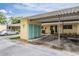 Building 6 exterior featuring covered parking, storage and manicured landscaping adding curb appeal at 2465 Northside Dr # 605, Clearwater, FL 33761
