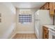 Efficient kitchen with a white refrigerator and a window with a checkered curtain at 2465 Northside Dr # 605, Clearwater, FL 33761