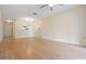 Open living room area with wood-look flooring, pass-through kitchen, and contemporary lighting at 2465 Northside Dr # 605, Clearwater, FL 33761