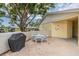 A private outdoor patio area with a grill and seating, perfect for enjoying the weather at 2465 Northside Dr # 605, Clearwater, FL 33761