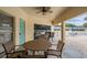 A cozy outdoor patio with seating and a ceiling fan, ideal for relaxing by the pool at 2465 Northside Dr # 605, Clearwater, FL 33761