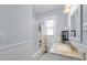 Bathroom featuring tub/shower combo, marble-top vanity, and a modern lighting fixture at 2811 W Sitios St, Tampa, FL 33629