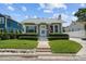 Charming home featuring manicured landscaping and walkway leading to the front door at 2811 W Sitios St, Tampa, FL 33629