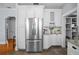 Stainless steel refrigerator complemented by white cabinets and countertops at 2811 W Sitios St, Tampa, FL 33629