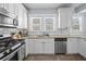 Charming kitchen with stainless steel appliances, bright lighting, and ample cabinet space at 2811 W Sitios St, Tampa, FL 33629