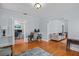 Comfortable living room showcases hardwood floors, white trim, and an open entryway at 2811 W Sitios St, Tampa, FL 33629
