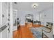 Sun-drenched living room boasts hardwood floors, a white-painted fireplace, and views into a brightly lit kitchen at 2811 W Sitios St, Tampa, FL 33629