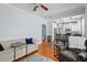 Inviting living room showcasing hardwood floors, a comfortable sofa, and an open view to the well-lit kitchen at 2811 W Sitios St, Tampa, FL 33629