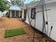 Backyard showing putting green, batting net, backyard shed, and rear view of building at 2820 Whitney Rd, Clearwater, FL 33760