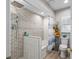 The bathroom has a shower with geometric tile and a built-in tub at 2820 Whitney Rd, Clearwater, FL 33760