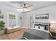 Bedroom with lots of natural light, ceiling fan, and wood-look floors at 2820 Whitney Rd, Clearwater, FL 33760