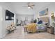 Cozy main bedroom with a sitting area and a large TV at 2820 Whitney Rd, Clearwater, FL 33760