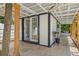 Inviting outdoor space with stone flooring, white wood trim, and stylish accents at 2820 Whitney Rd, Clearwater, FL 33760